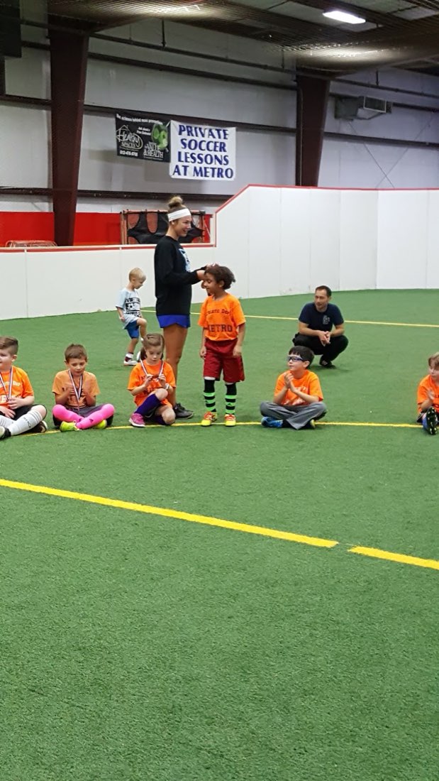 Receiving a medal at Metro indoor soccer